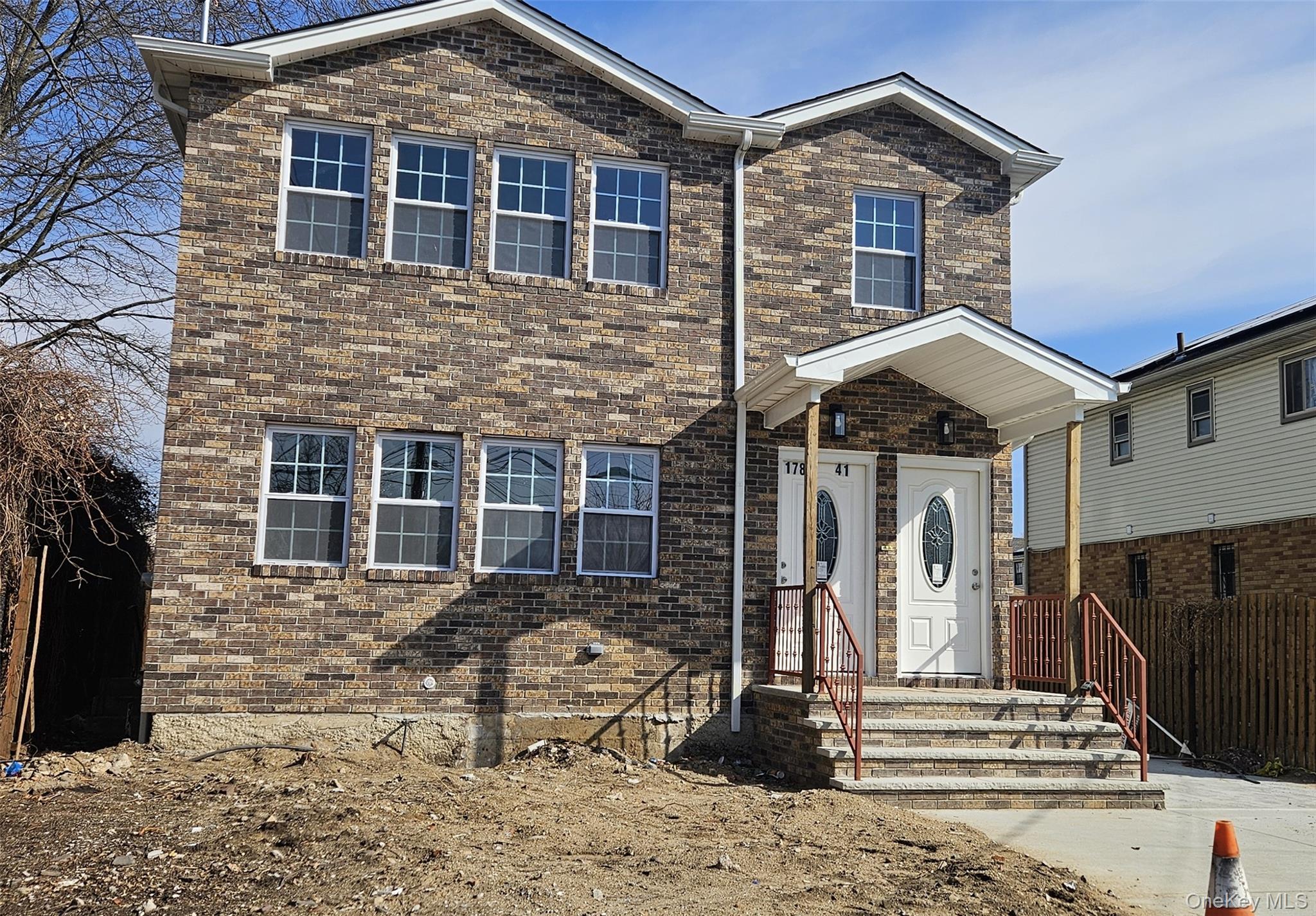 178-41 146th Terrace Queens, NY 11413 - Photo 1 of 23 a front view of a house with stairs