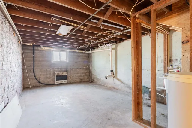 a view of an empty room with a fireplace