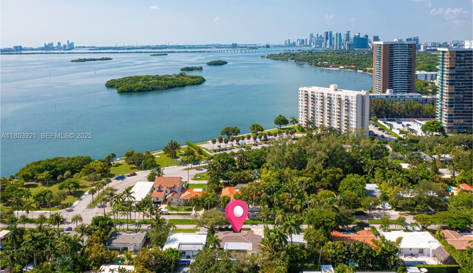 a aerial view of a city with lots of palm trees
