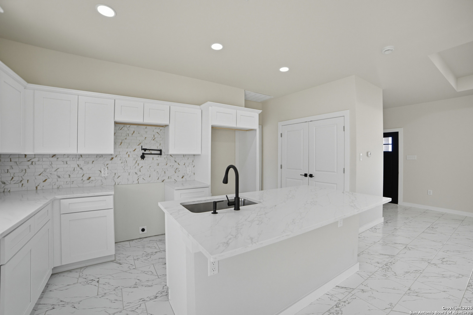 16724 Tapatio Street Atascosa, TX 78002 - Photo 15 of 29 a kitchen with a sink and cabinets