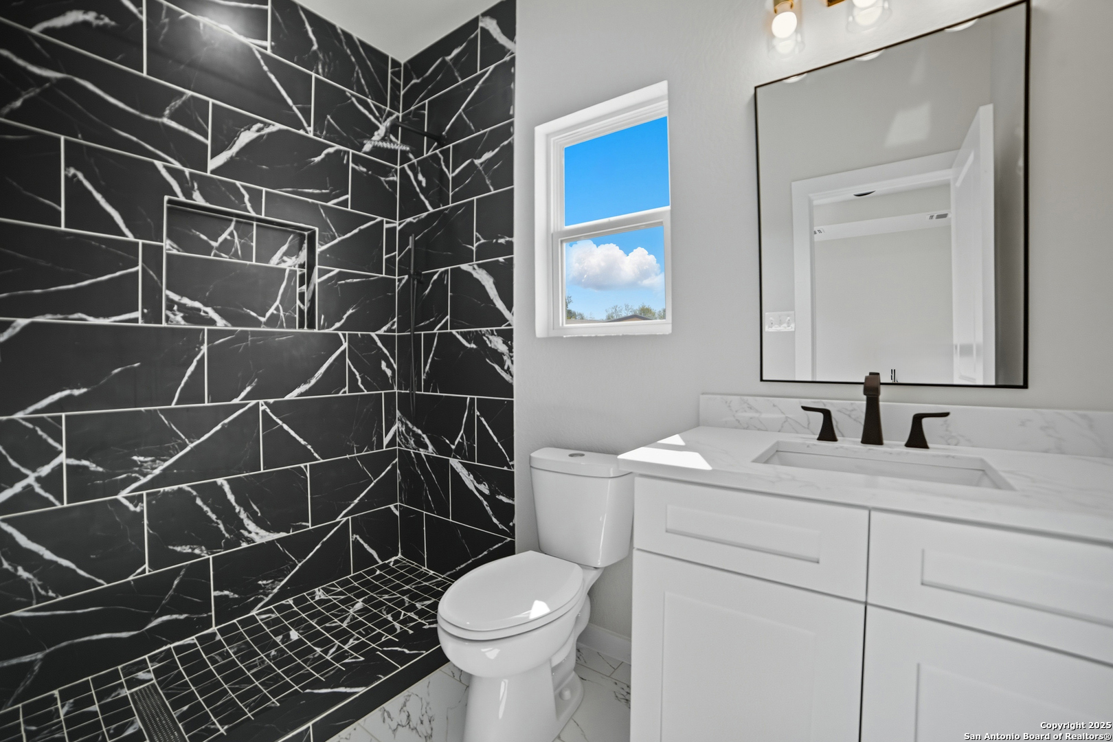 16724 Tapatio Street Atascosa, TX 78002 - Photo 19 of 29 a bathroom with a sink toilet and shower