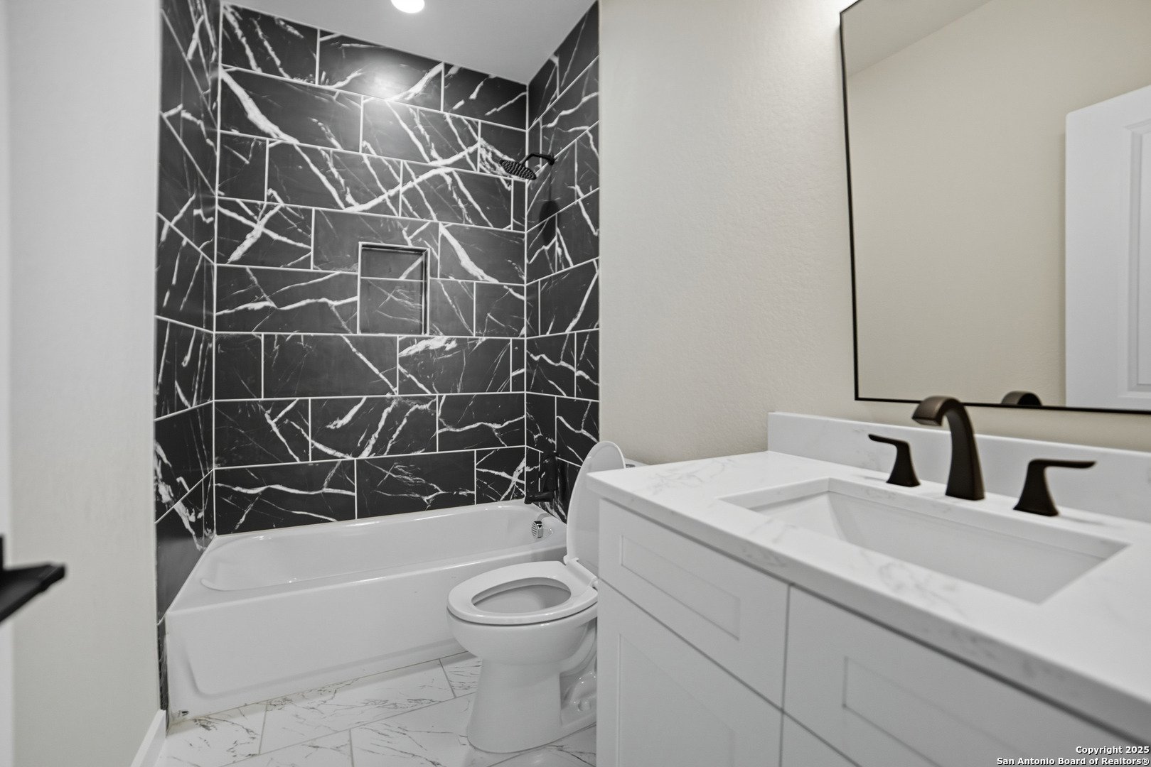 16724 Tapatio Street Atascosa, TX 78002 - Photo 23 of 29 a bathroom with a sink toilet and shower