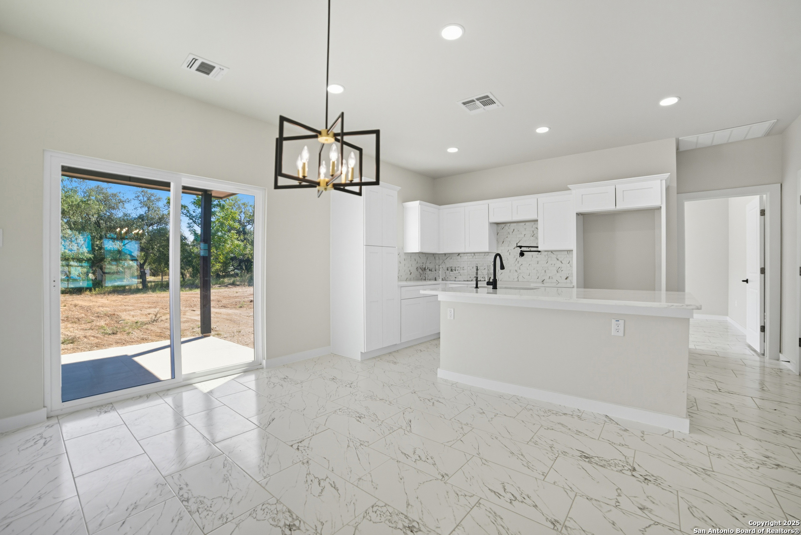 16724 Tapatio Street Atascosa, TX 78002 - Photo 10 of 29 a view of kitchen with stainless steel appliances refrigerator oven and cabinets