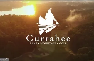 a view of a lake in middle of forest