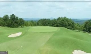 a view of a lake with a outdoor space