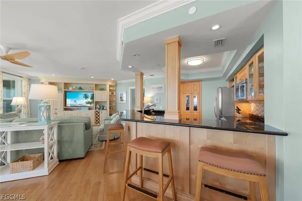 a large kitchen with a table and chairs