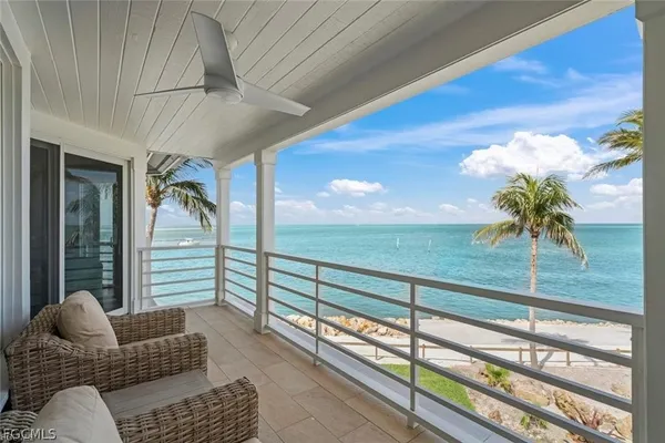 swimming pool view with a seating space