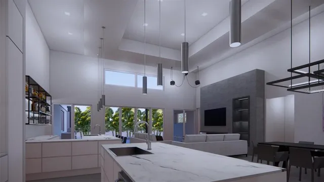 a kitchen with stainless steel appliances kitchen island a large island in the middle