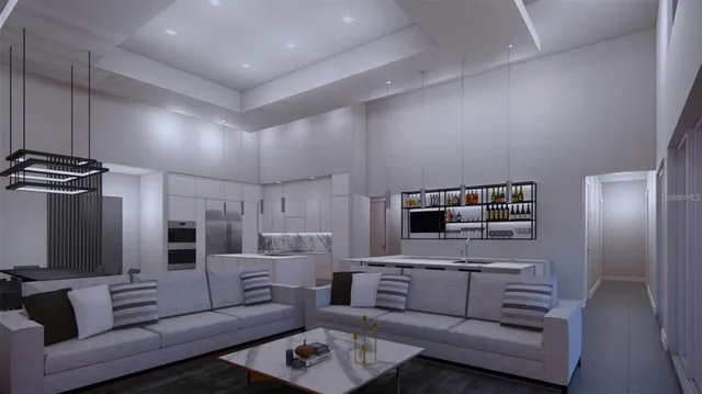 a living room with furniture and kitchen view