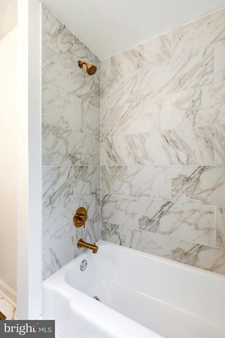 a en suite bathroom with a double vanity sink and a mirror