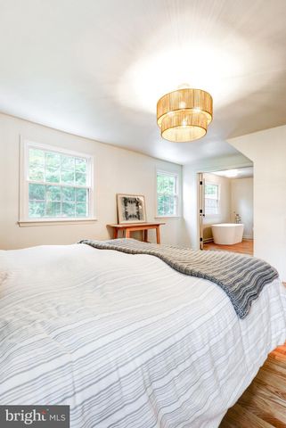 a white toilet sitting next to a shower