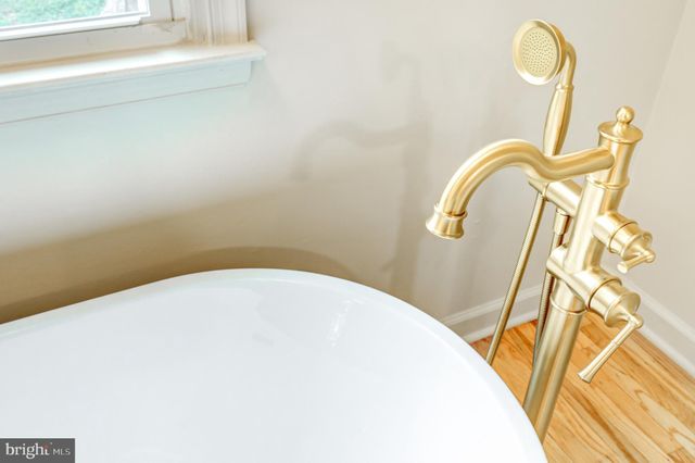 a view of an empty room with a fireplace