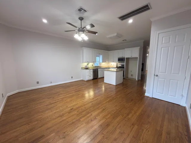 a view of kitchen and sink with wooden floor