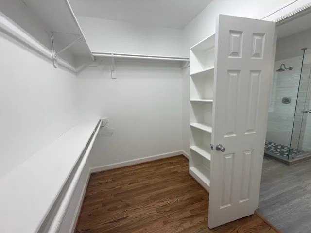 a view of an empty walk in closet