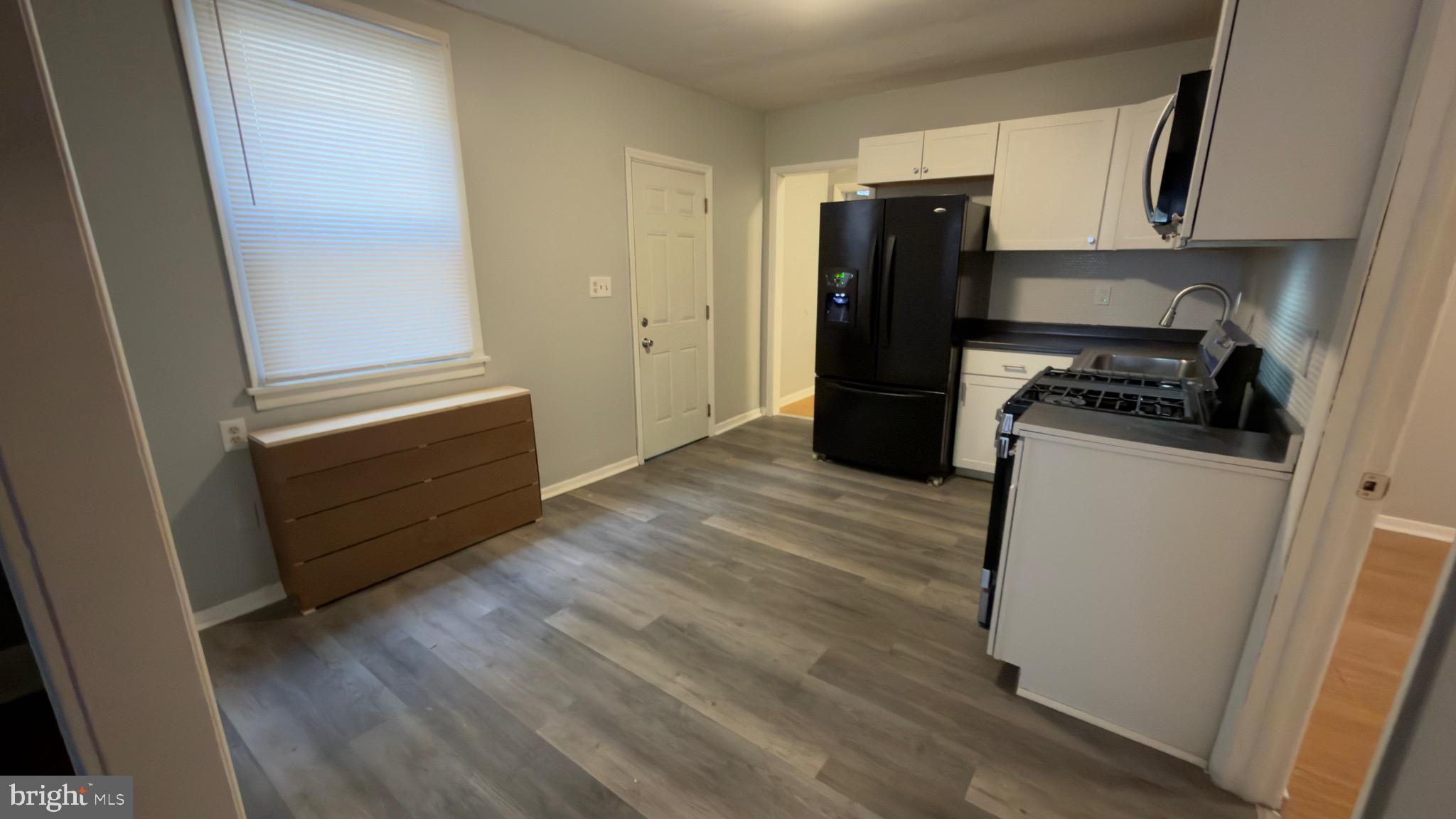 5 Samuel Street Hamilton, NJ 08610 - Photo 2 of 14 a kitchen with a refrigerator and a stove top oven