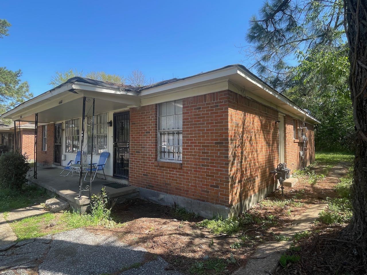 View of side of home featuring brick siding
