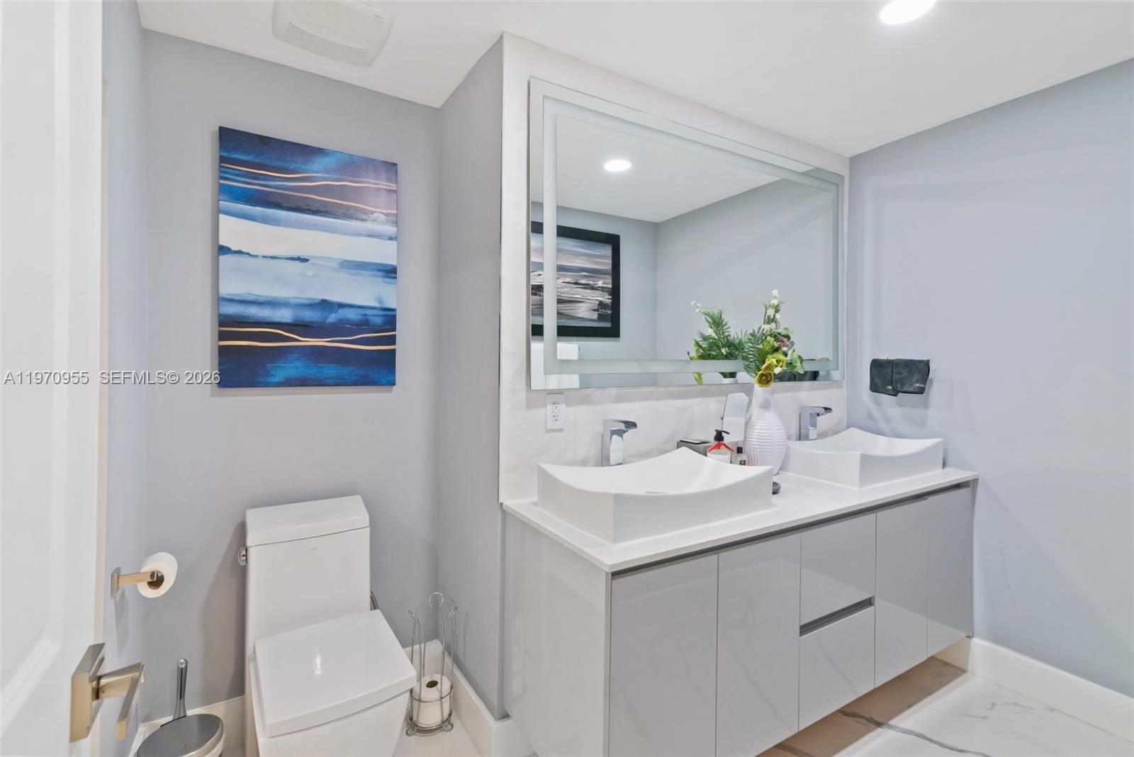 830 Southwest 93rd Avenue Miami, FL 33174 - Photo 11 of 48 a bathroom with a toilet sink and mirror