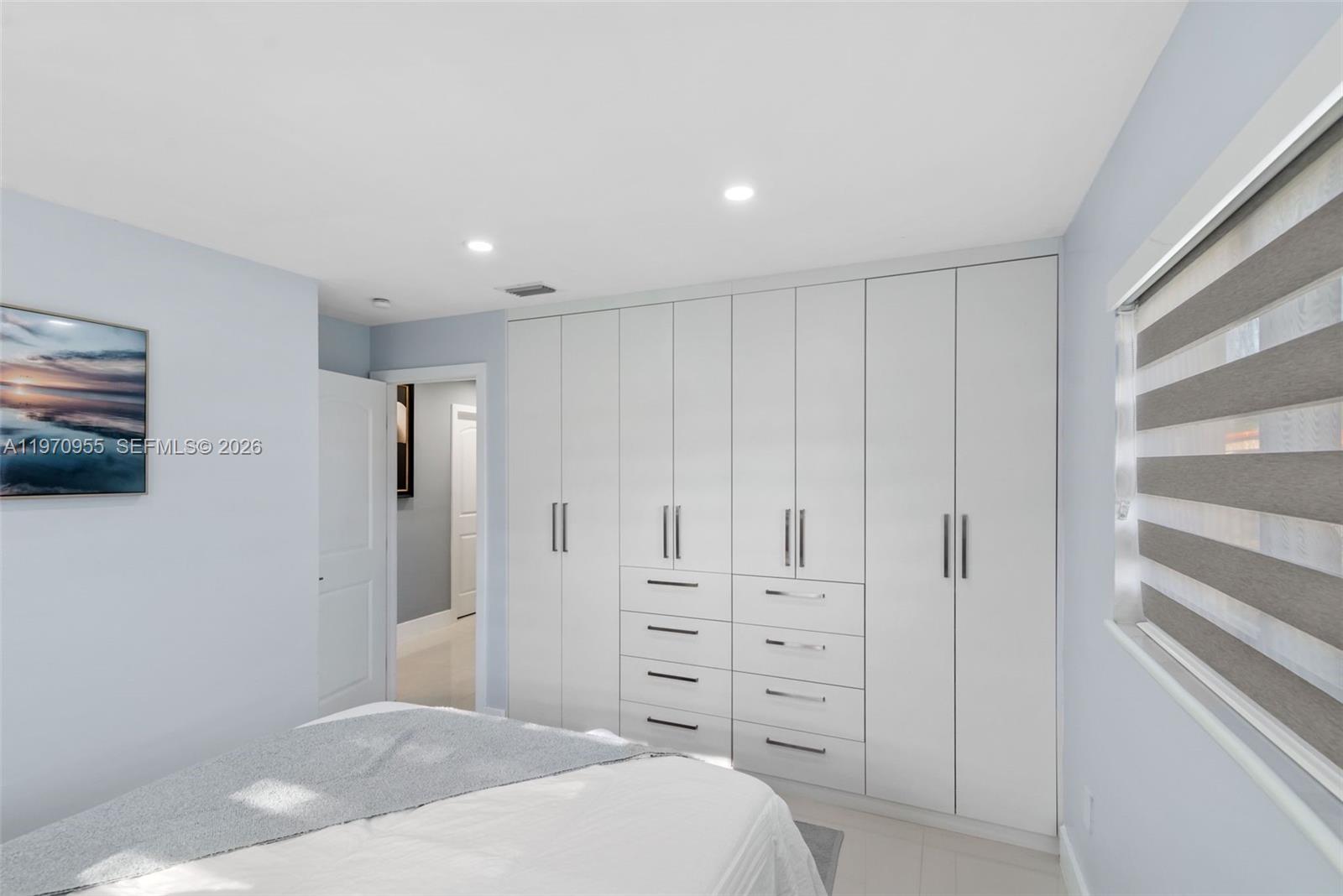830 Southwest 93rd Avenue Miami, FL 33174 - Photo 12 of 48 a spacious bedroom with a bed and a flat screen tv