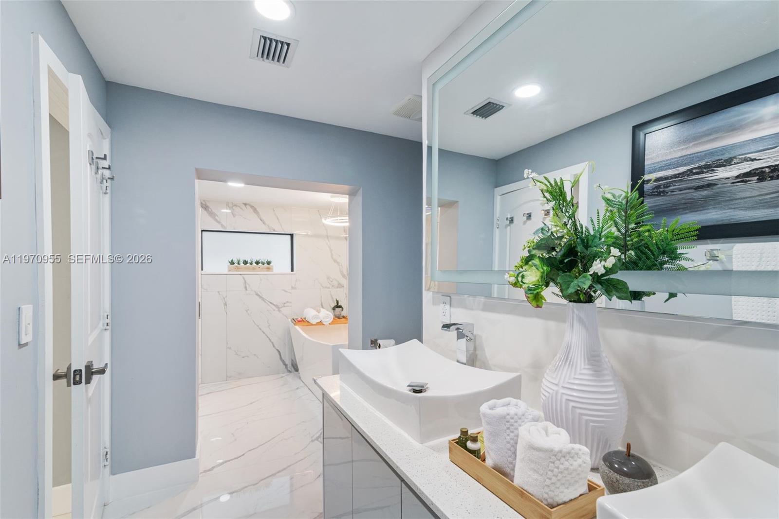 830 Southwest 93rd Avenue Miami, FL 33174 - Photo 14 of 48 a bath room with a sink and mirror