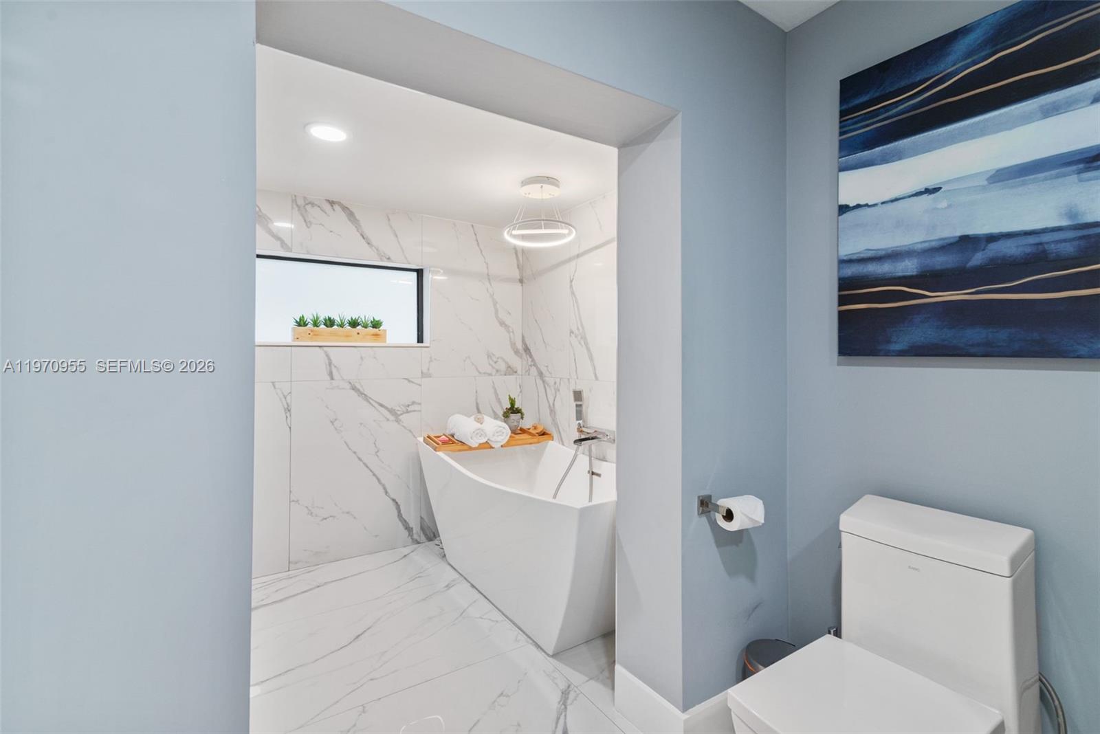 830 Southwest 93rd Avenue Miami, FL 33174 - Photo 15 of 48 a bathroom with a sink a bathtub and a toilet