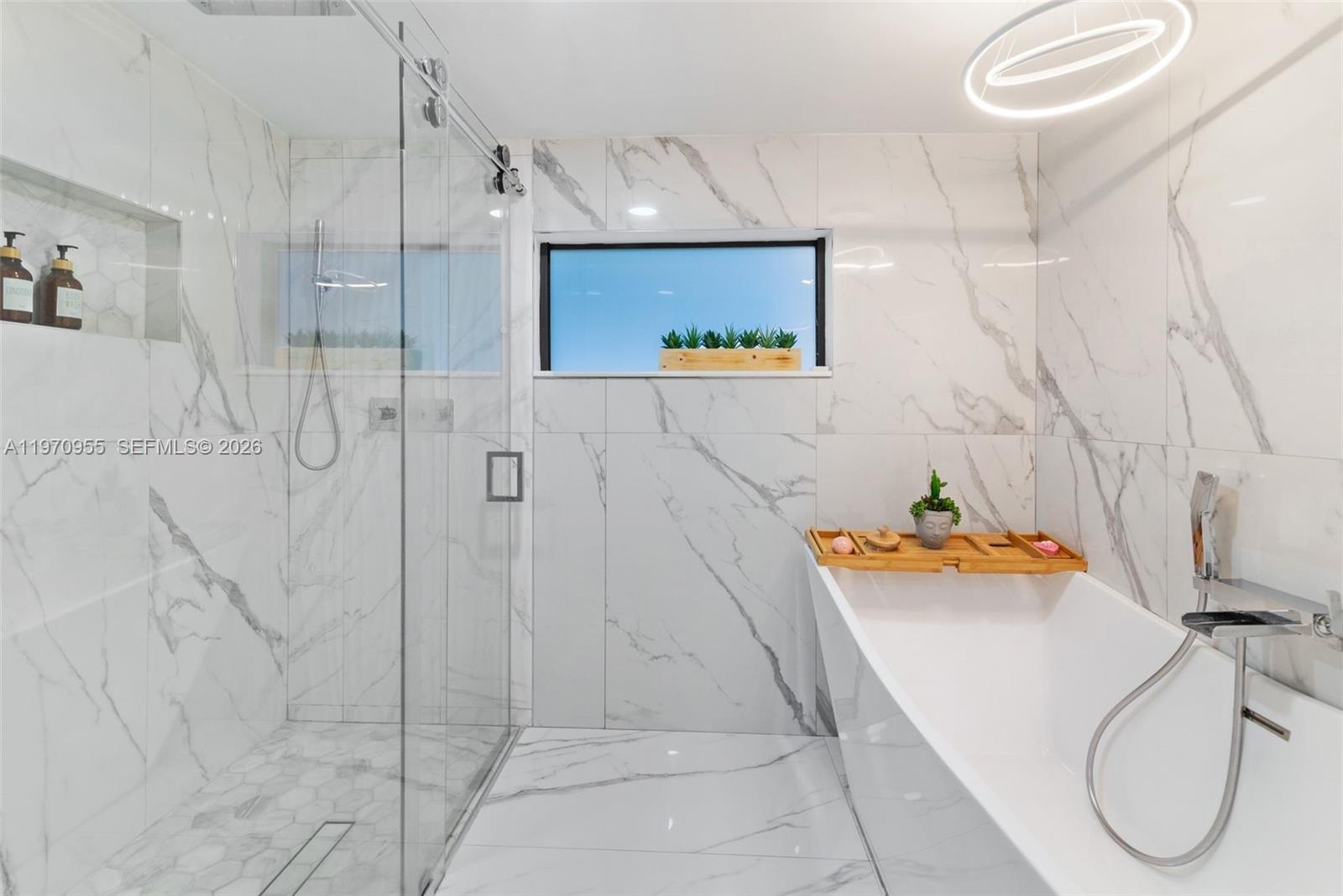 830 Southwest 93rd Avenue Miami, FL 33174 - Photo 17 of 48 a bathroom with a tub and shower