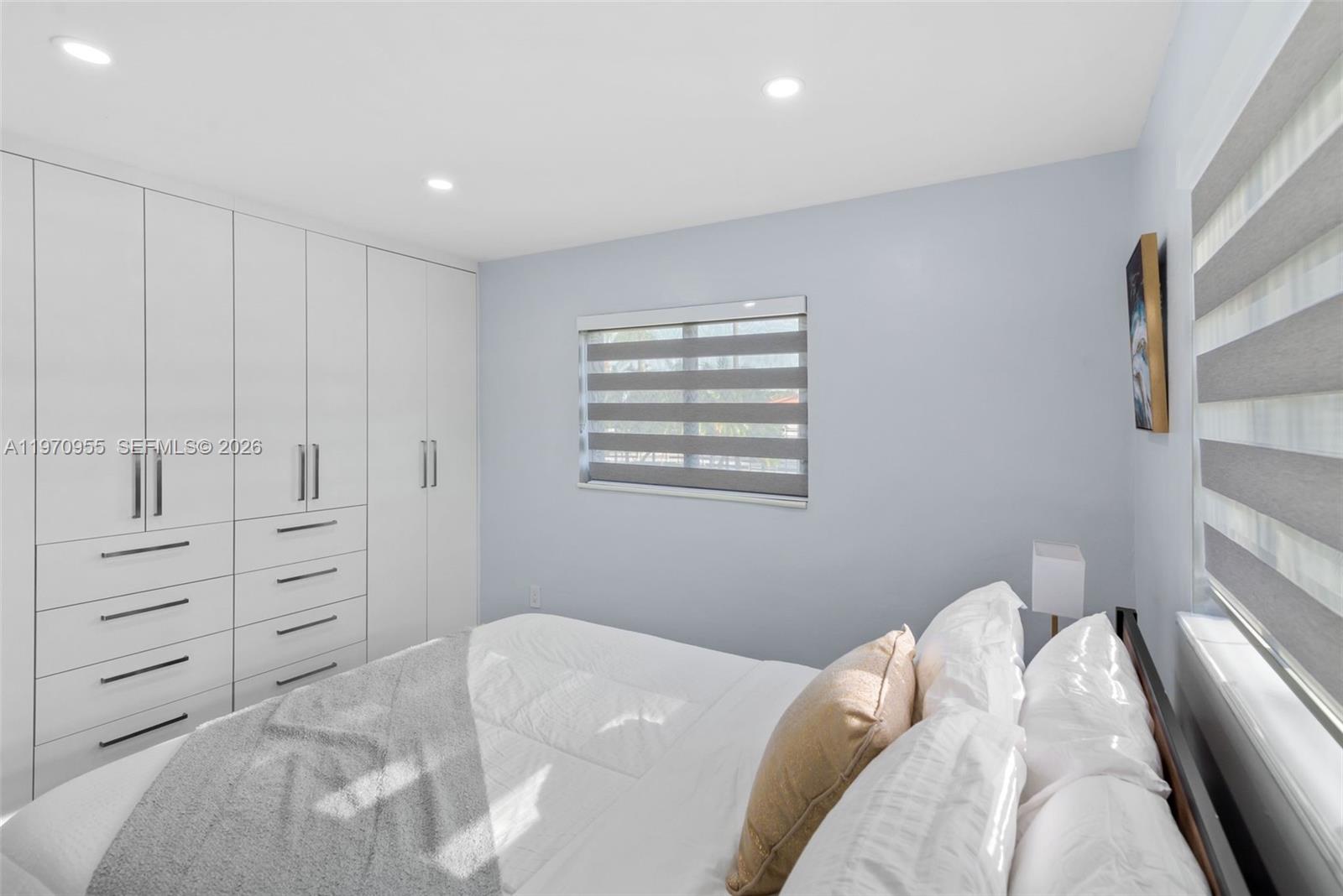 830 Southwest 93rd Avenue Miami, FL 33174 - Photo 19 of 48 a bedroom with a bed and a window