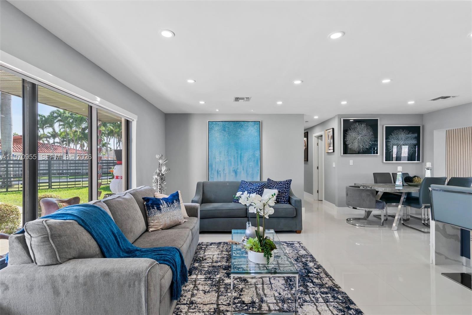 830 Southwest 93rd Avenue Miami, FL 33174 - Photo 2 of 48 a living room with furniture and a large window
