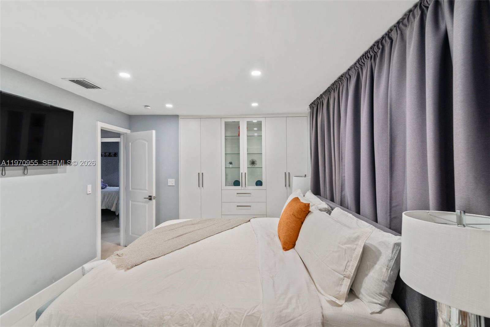 830 Southwest 93rd Avenue Miami, FL 33174 - Photo 21 of 48 a bedroom with a bed and a flat screen tv