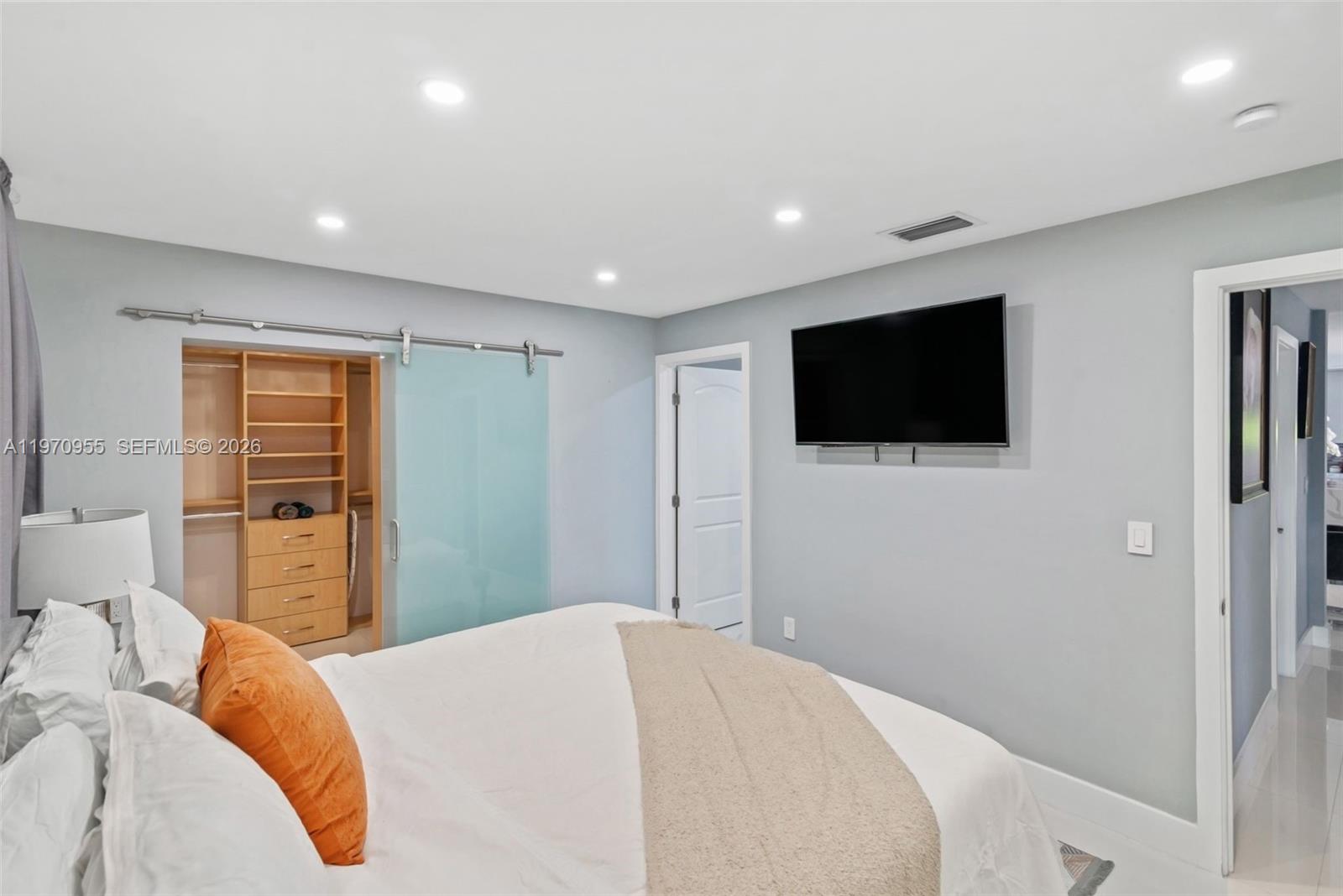 830 Southwest 93rd Avenue Miami, FL 33174 - Photo 22 of 48 a bedroom with a bed and a flat screen tv