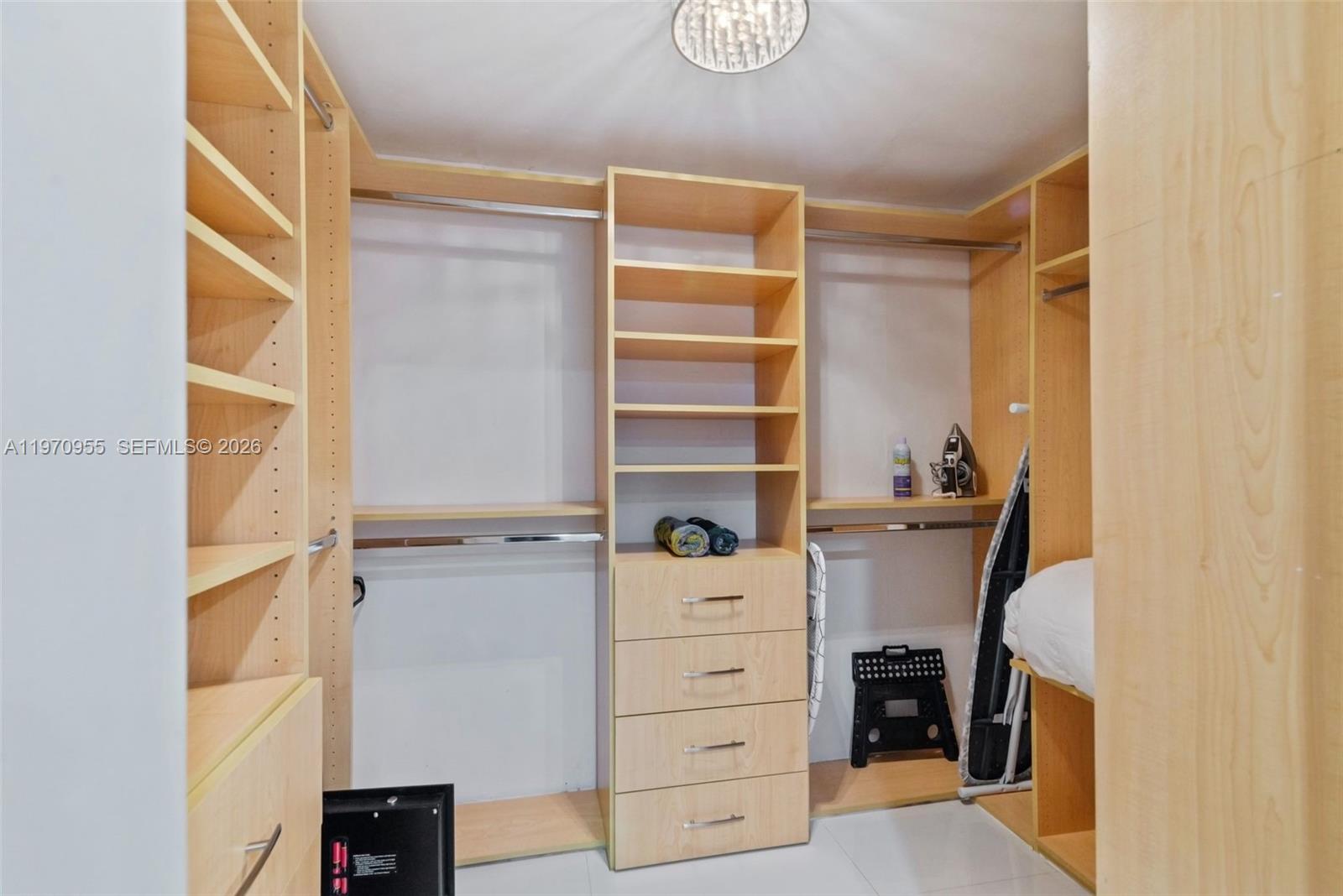 830 Southwest 93rd Avenue Miami, FL 33174 - Photo 23 of 48 a view of walk in closet with clothes and shoes