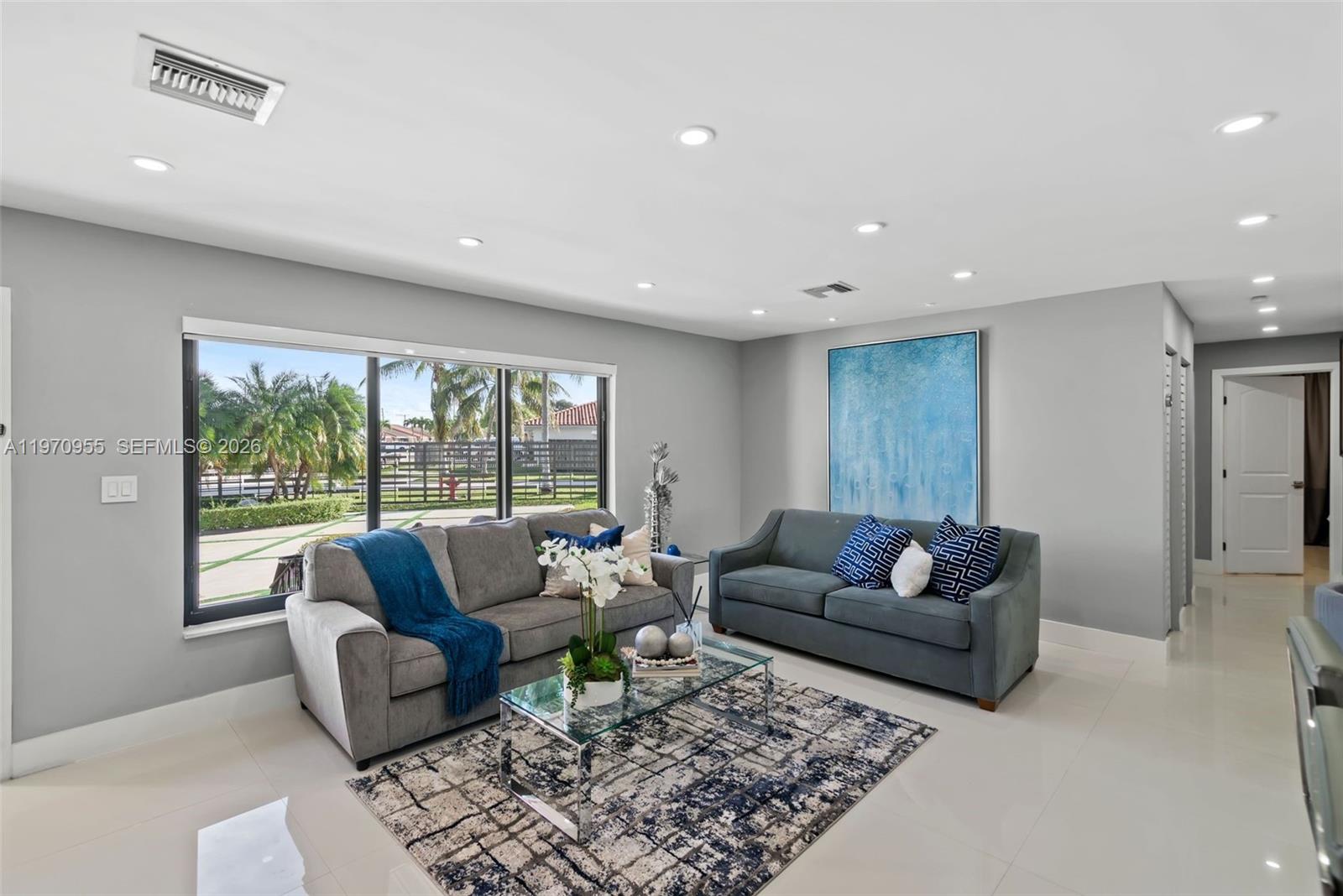 830 Southwest 93rd Avenue Miami, FL 33174 - Photo 3 of 48 a living room with furniture and a large window