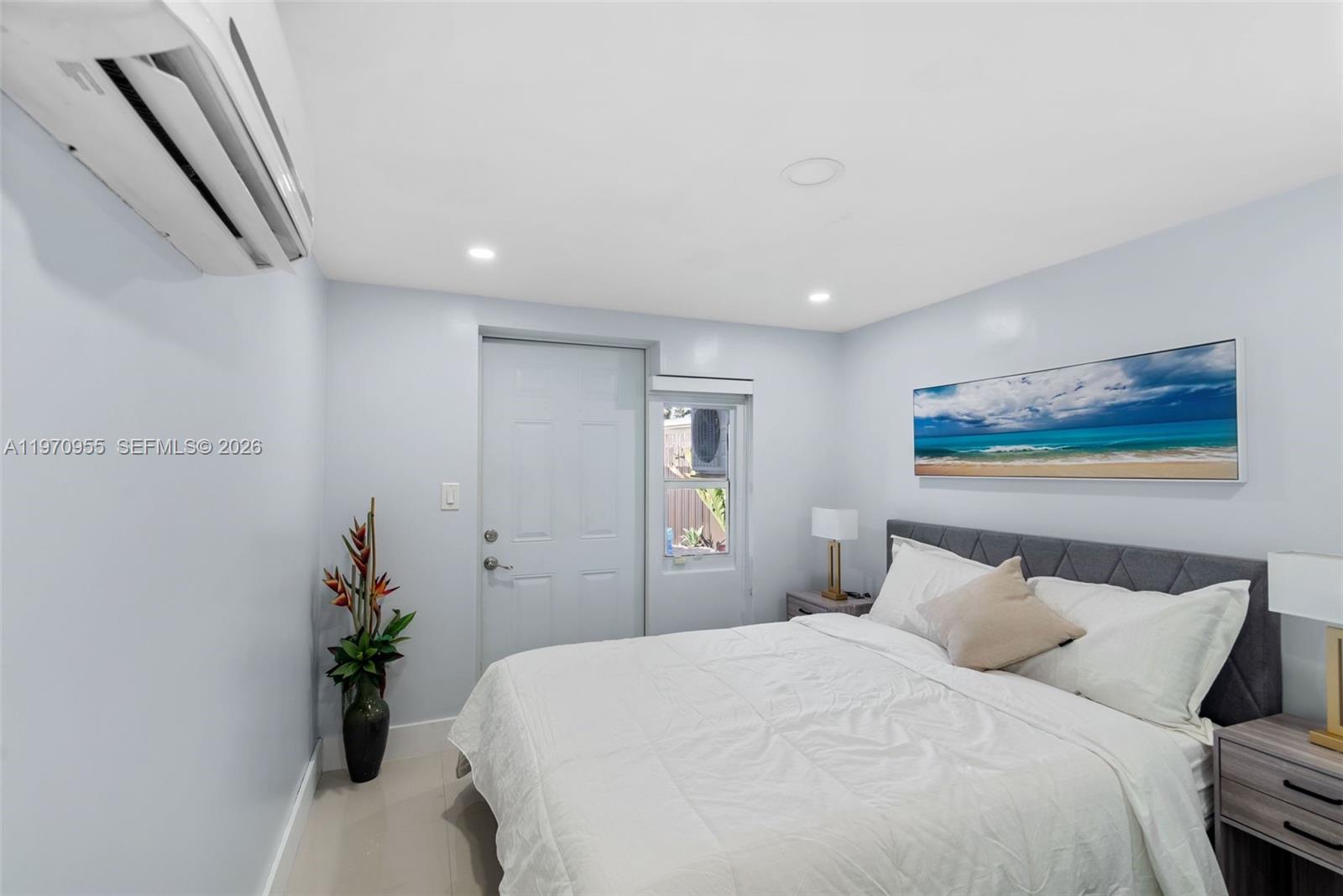 830 Southwest 93rd Avenue Miami, FL 33174 - Photo 33 of 48 a bedroom with bed and wooden floor