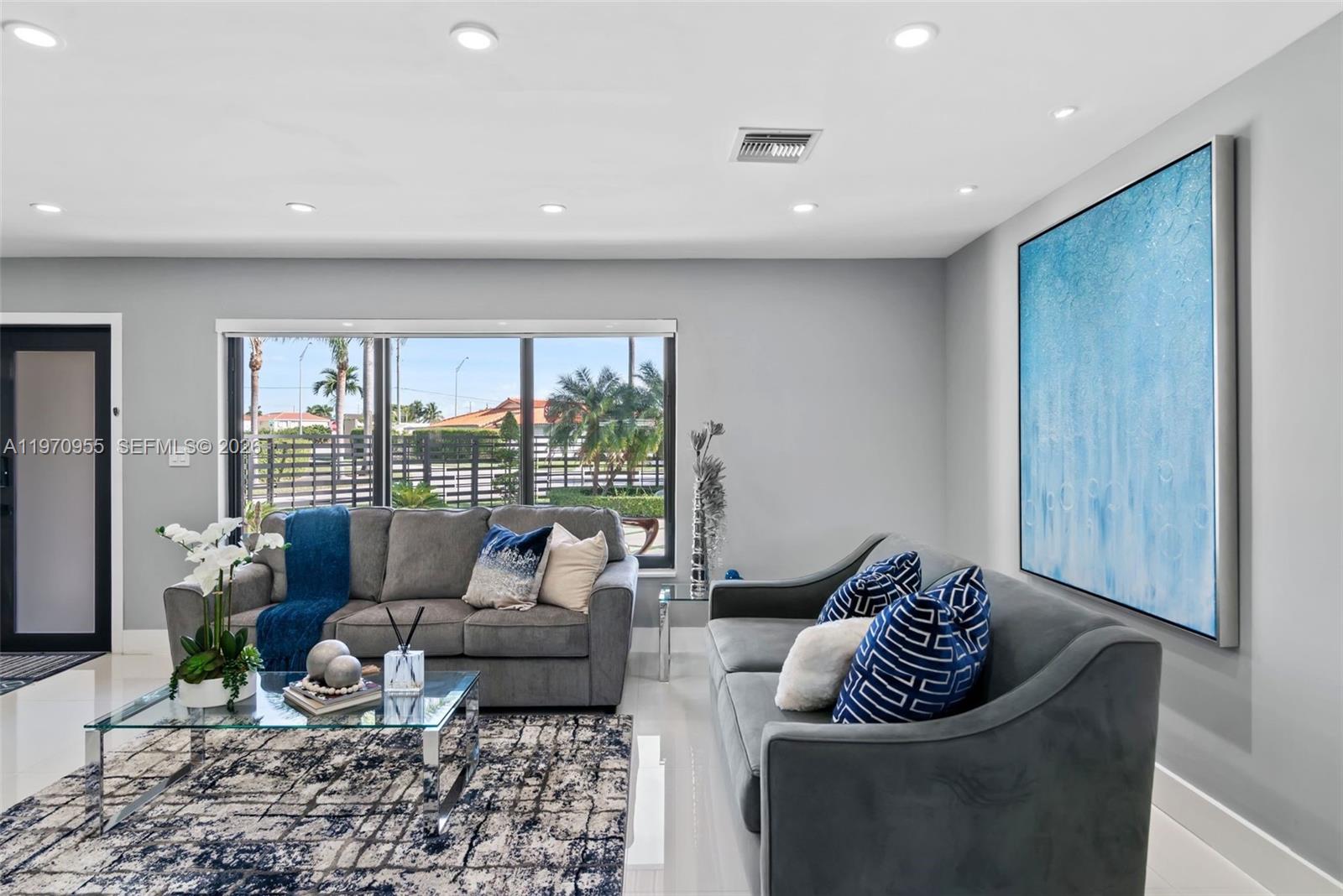 830 Southwest 93rd Avenue Miami, FL 33174 - Photo 4 of 48 a living room with furniture and a floor to ceiling window