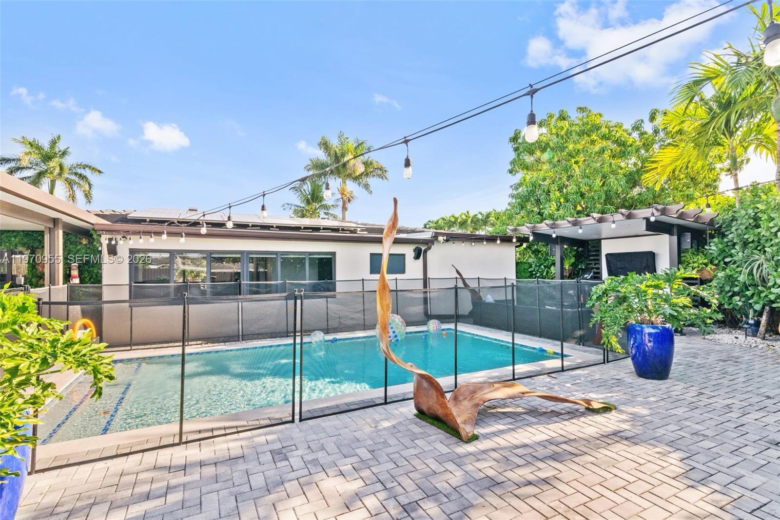 830 Southwest 93rd Avenue Miami, FL 33174 - Photo 44 of 48 a view of a house with a yard and sitting area
