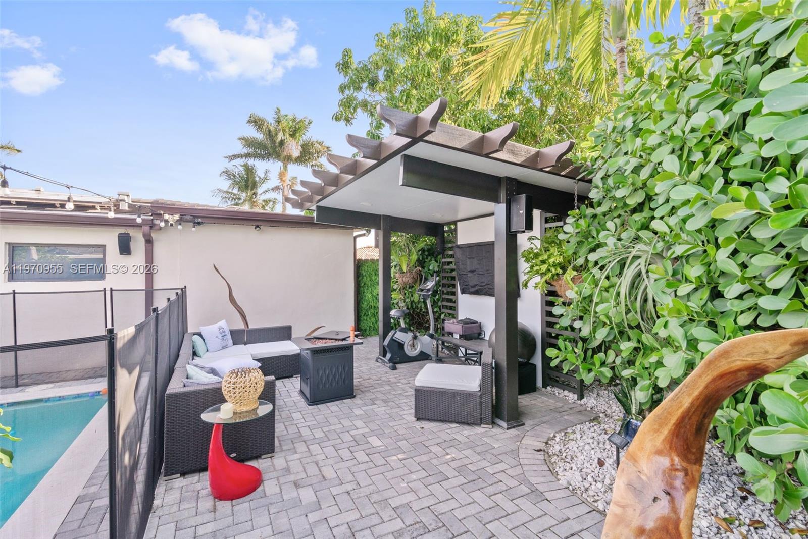 830 Southwest 93rd Avenue Miami, FL 33174 - Photo 46 of 48 a view of a patio with table and chairs potted plants