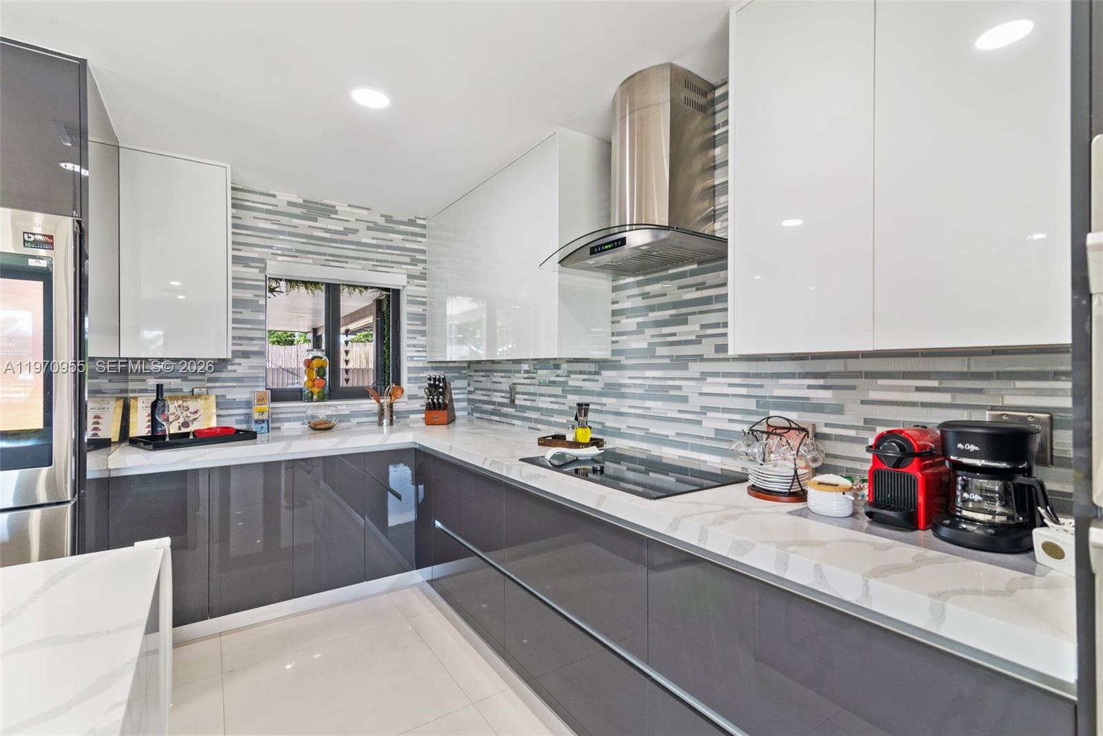 830 Southwest 93rd Avenue Miami, FL 33174 - Photo 5 of 48 a kitchen with stainless steel appliances a sink and cabinets