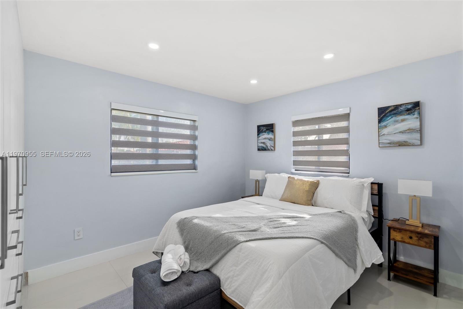 830 Southwest 93rd Avenue Miami, FL 33174 - Photo 10 of 48 a bedroom with a large bed and a window