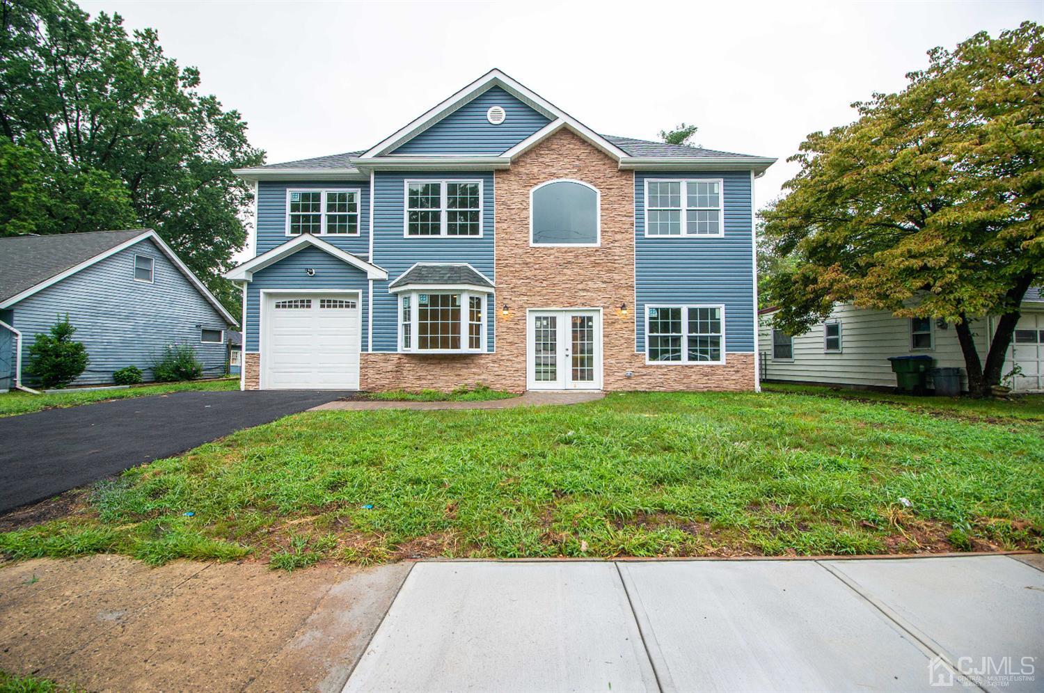 14 Caldwell Road Edison, NJ 08817 - Photo 1 of 22 front view of a house with a yard