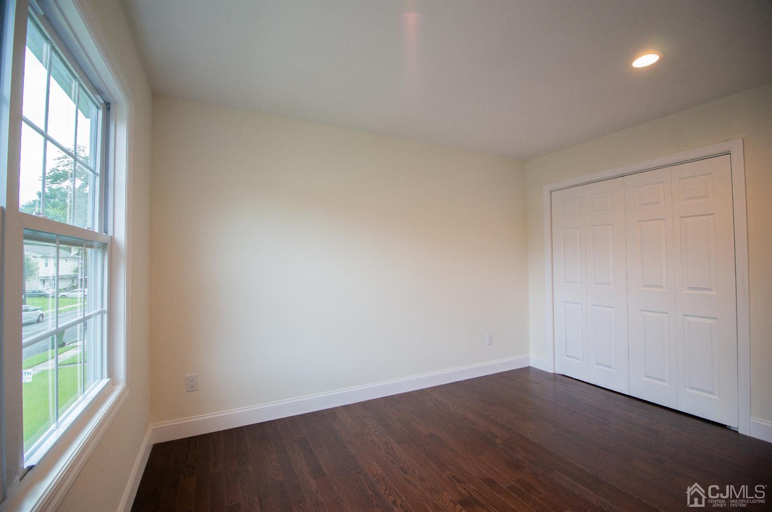 14 Caldwell Road Edison, NJ 08817 - Photo 17 of 22 an empty room with wooden floor and windows