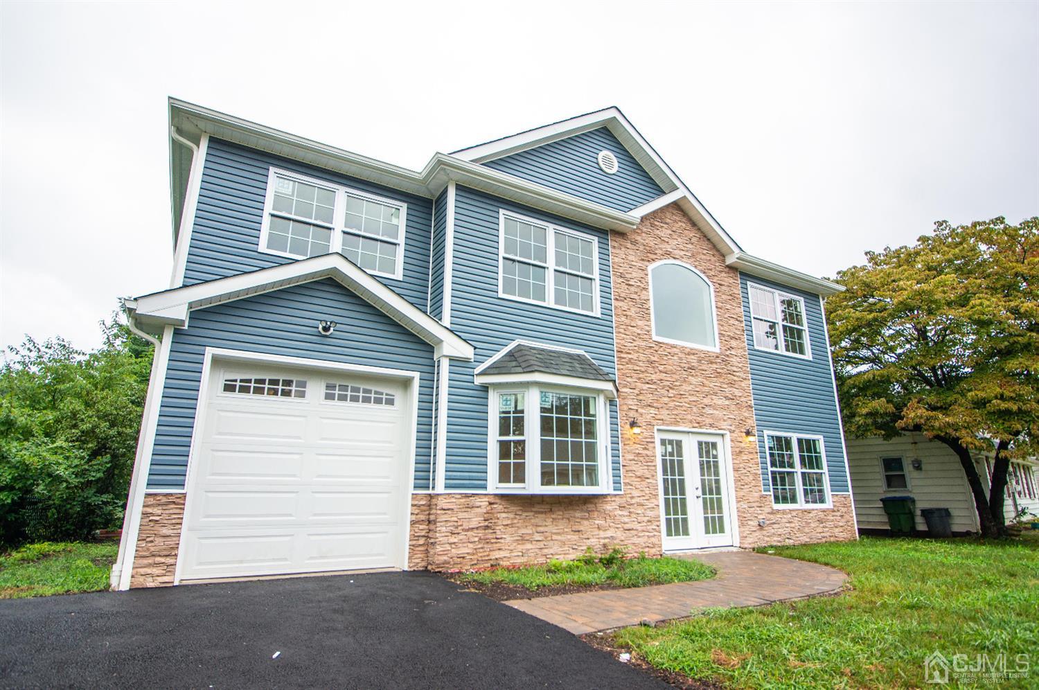 14 Caldwell Road Edison, NJ 08817 - Photo 3 of 22 front view of a house with a yard