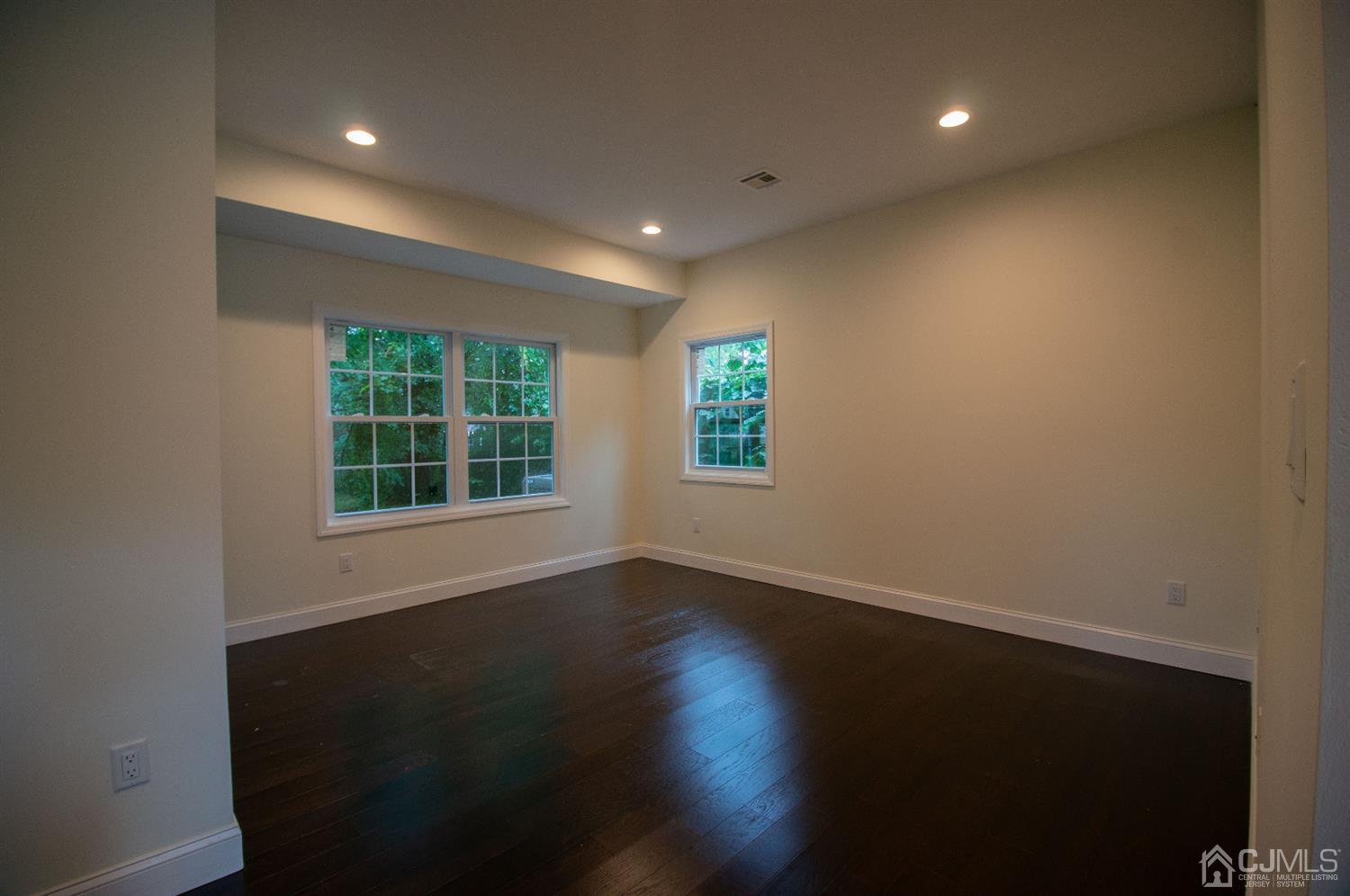 14 Caldwell Road Edison, NJ 08817 - Photo 22 of 22 a view of an empty room with wooden floor and a window