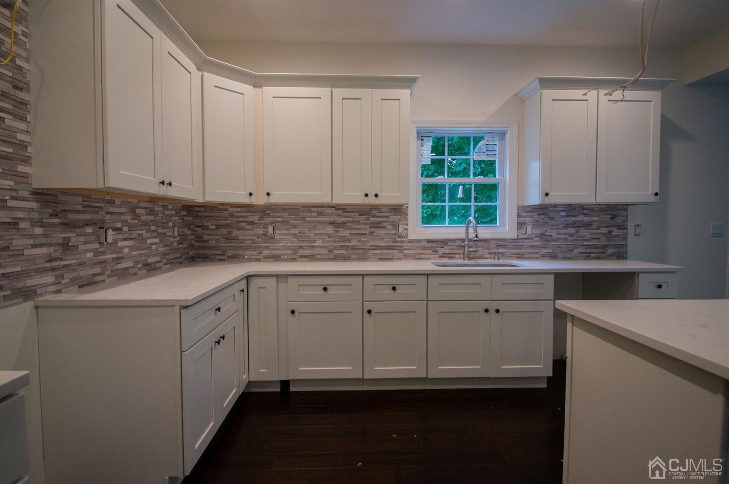 14 Caldwell Road Edison, NJ 08817 - Photo 5 of 22 a kitchen with stainless steel appliances granite countertop a sink a stove and a window