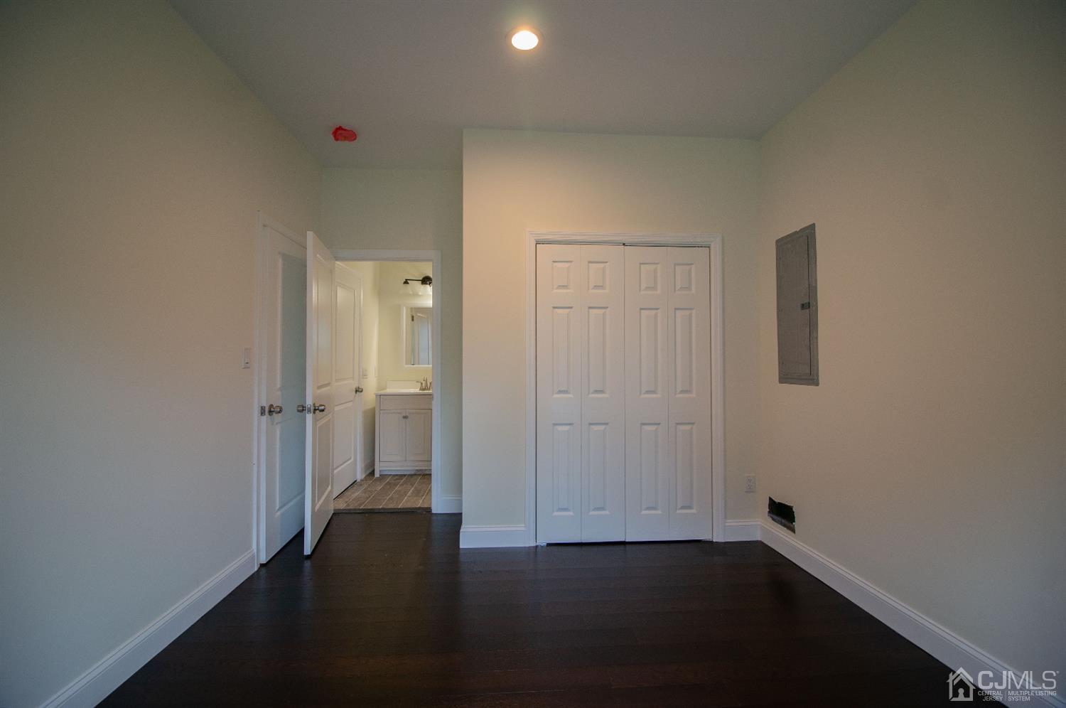 14 Caldwell Road Edison, NJ 08817 - Photo 7 of 22 an empty room with wooden floor and windows