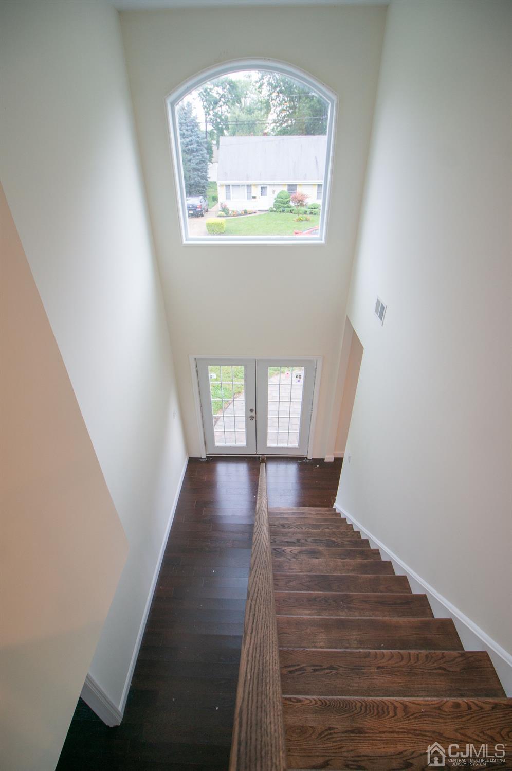 14 Caldwell Road Edison, NJ 08817 - Photo 10 of 22 a view of hallway with window and wooden floor
