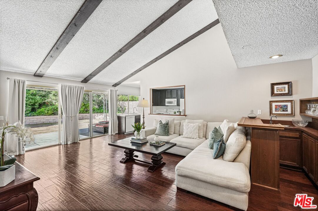 10621 Vanalden Avenue Porter Ranch, CA 91326 - Photo 14 of 38 a living room with furniture and a large window