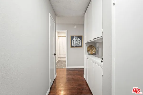 a view of a hallway with door