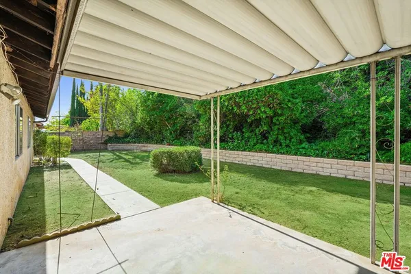 a view of a backyard with a garden