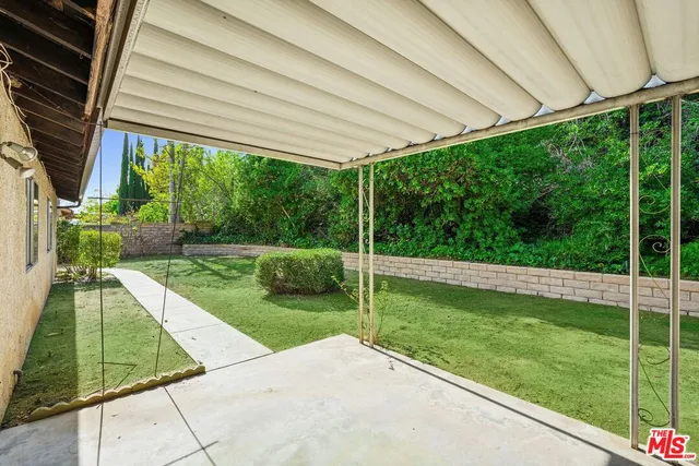 a view of a backyard with a garden