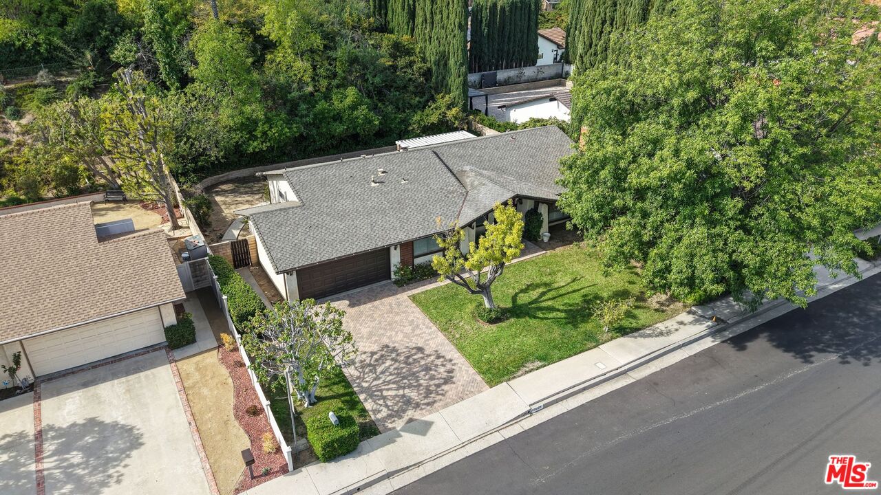 10621 Vanalden Avenue Porter Ranch, CA 91326 - Photo 38 of 38 an aerial view of a house with a yard and potted plants