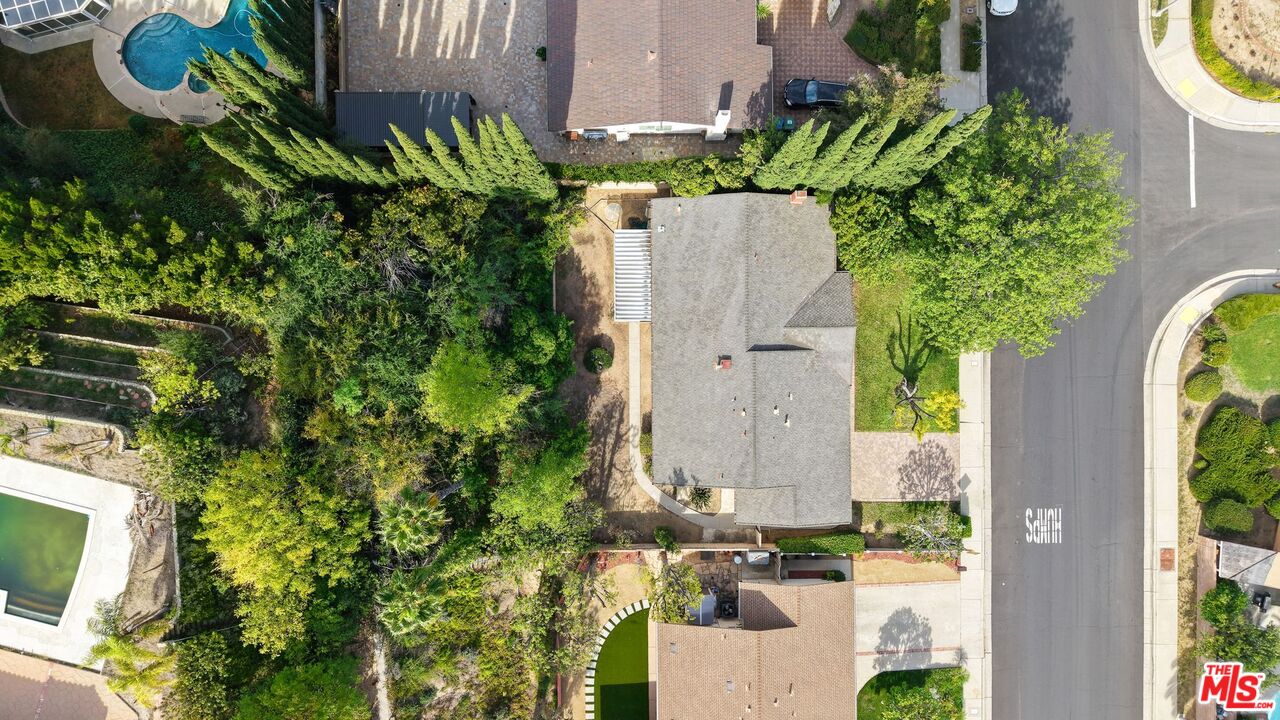 10621 Vanalden Avenue Porter Ranch, CA 91326 - Photo 4 of 38 aerial view of a house with a yard and garden